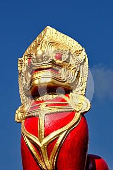 Guardian lion statue soaring into blue sky