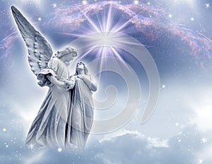 Guardin angel over a divine mystic background with stars photo