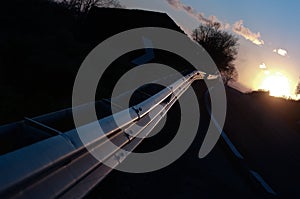 Guardrail Vanish On Road At Sunset