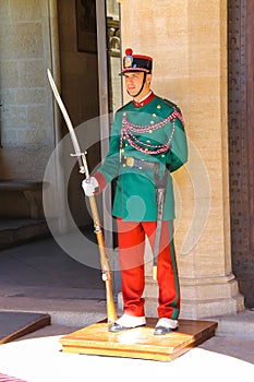 Guardsman in colorful uniforms on a post near the Palazzo Pubblicco in San Marino.