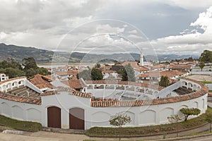 Guatavita town landscape with bullring at front and andean moutnains at background photo