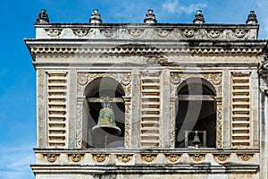 Closeup, Bells on side of San Francisco church, La Antigua, Guatemala photo