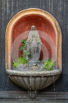 Closeup, Virgin Mary fountain at shopping mall, La Antigua, Guatemala photo