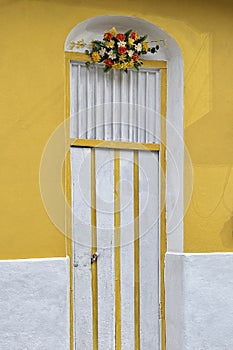 Beautiful decorated door of a house in Flores Island in Guatemala photo