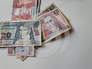 guatemalan banknotes of different denominations on the table