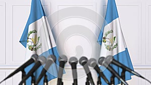 Guatemalan official press conference. Flags of Guatemala and microphones. Conceptual 3D animation