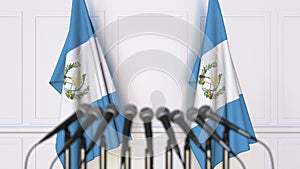 Guatemalan official press conference. Flags of Guatemala and microphones. Conceptual 3D rendering