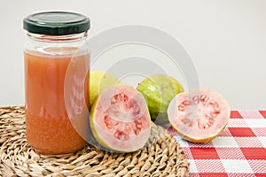 Guava fruit with a bottle of juice