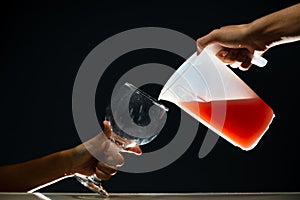 Guava juice being served in a glass goblet