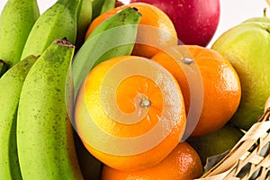 Guava and orange and banana are many fresh fruits mixed together on  background fruit health food