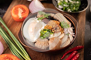 Guay Jap, meatballs, Vietnamese Pork Sausage and a fried egg, Thai food photo
