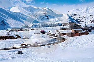 Gudauri winter resort in Georgia. Snow mountain peaks with infrastructure