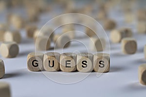 Guess - cube with letters, sign with wooden cubes