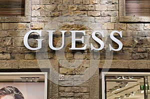 Guess store sign hanging in Florence, Italy