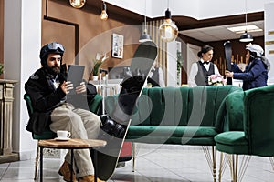 Guest browsing on tablet in reception photo
