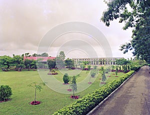 Guest house with plush garden & trees & pathway