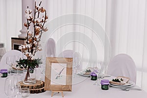 Guest table, with bouquet from cotton and frame with number