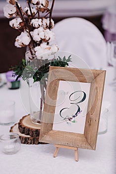 Guest table, with bouquet from cotton and frame with number