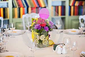 Guest table decorated with gaudy bouquet photo