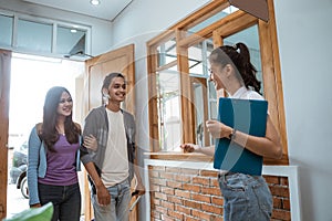 guesthouse staff welcoming couple in boutique hotel