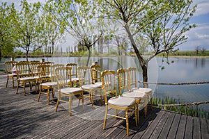 Guests chairs and decorations with lake environment