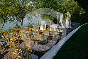 Guests chairs and decorations with lake environment