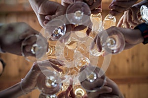 Guests clink their champagne flutes in preparation of the days e
