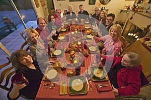 Guests at an elegant Thanksgiving dinner party