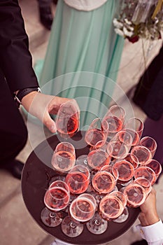 Guests serving drink at wedding