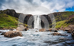 Gufufoss waterfall flowing thourgh rocks in summer at Seydisfjordur, East of Iceland