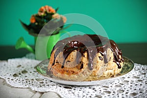 Gugelhopf or Bundt cake covered with melted chocolate