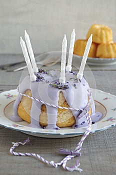 Gugelhupf with icing and lavender as birthday cake