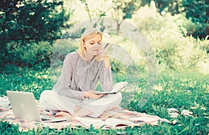 Guide starting freelance career. Become successful freelancer. Woman with laptop sit on rug grass meadow. Girl with