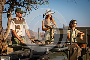 Guide and two female guests in jeep