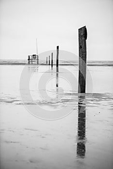 Guiding poles during low tide, North Sea