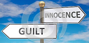 Guilt and innocence as different choices in life - pictured as words Guilt, innocence on road signs pointing at opposite ways to