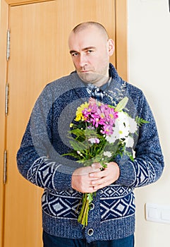 Guilty man with flowers