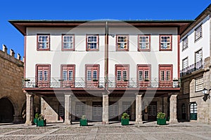 Guimaraes, Portugal. Medieval building in Oliveira Square photo