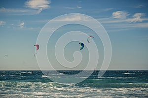 Guincho beach sea with surfers doing kitesurf