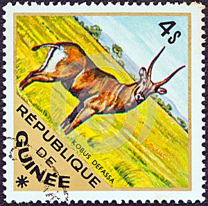 GUINEA - CIRCA 1975: A stamp printed in Guinea from the `Wild Animals` issue shows a Defassa Waterbuck Kobus defassa