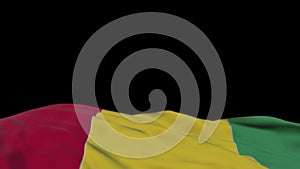 Guinea fabric flag waving on the wind loop. Guinean embroidery stiched cloth banner swaying on the breeze. Half-filled black