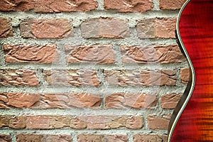 Guitar against brick wall background