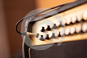 Guitar amplifier on bokeh light colored background, classic vintage rock sound. DSL20c tube amp