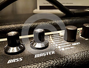 Guitar amplifier knobs closeup. Bass, Master, Presets