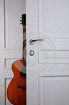 guitar behind the door