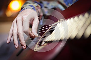 A guitar being played by performer photo