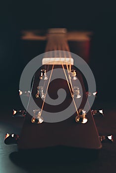 Guitar on black background with shallow depht of field