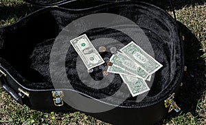 Guitar case with money busker