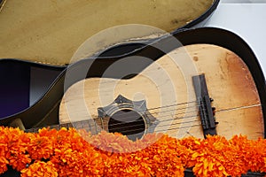 Old Guitar and cempasuchil flowers, day of the dead, mexico I photo