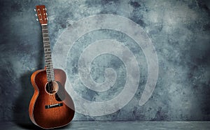 Guitar on grunge wall background